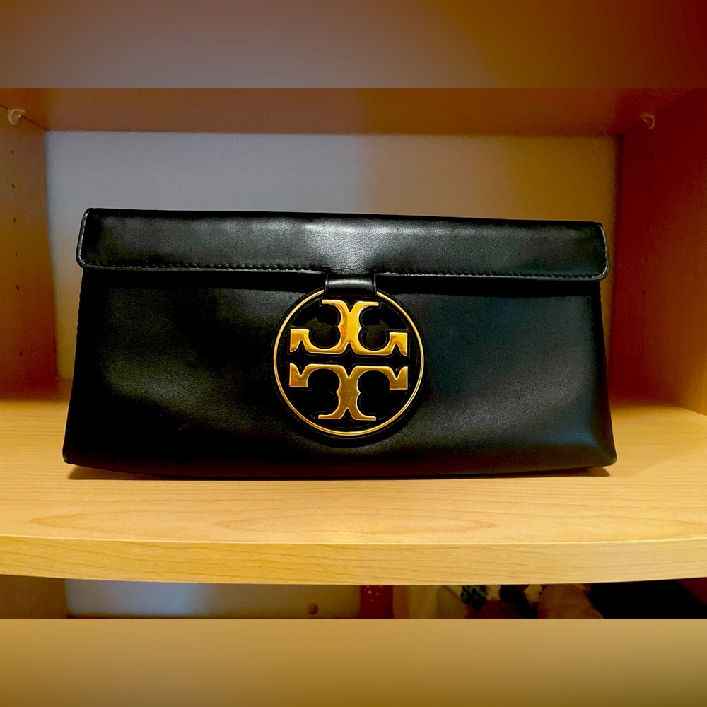 Stunning Tory Burch black leather clutch.